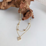 Ketten von iced studios™: Double Heart Choker 18K Vergoldet